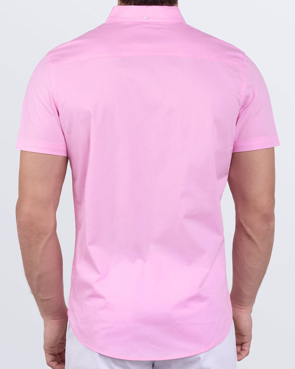 Back view of La Beach en Rose shirt showing modern fit and curved hem in soft pink cotton.