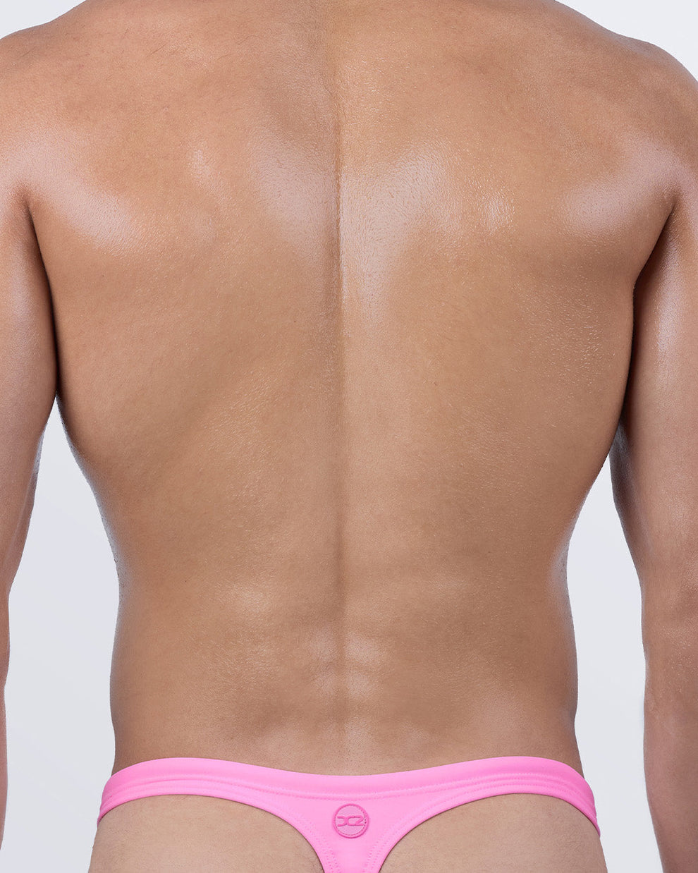 Back view of LA BEACH EN ROSE swim thong featuring minimal "T" back coverage with DC2 logo.