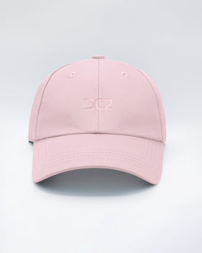 DC2 Resort Cap in Leisure Pink — front view showcasing a curved brim, structured crown, and tonal embroidered DC2 logo.