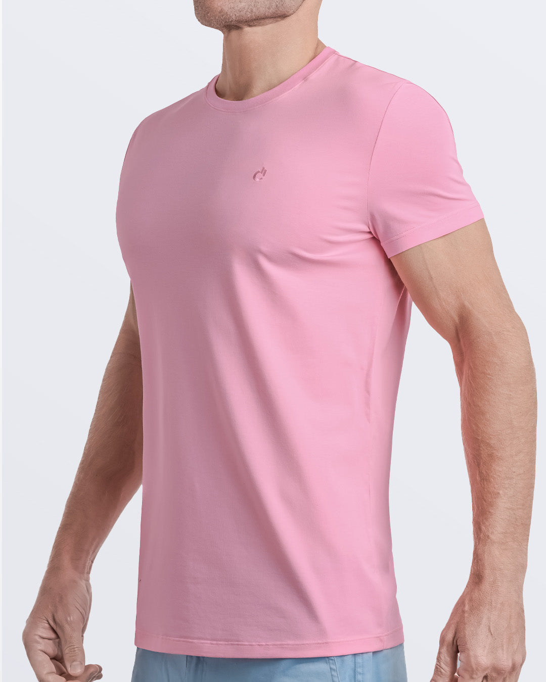 Side view of a men's premium light pink modal cotton t-shirt and embroidered DC2 logo. Perfect for a modern casual look, this streetwear tee is part of the DC2 Miami men's beachwear collection, designed for comfort and style.