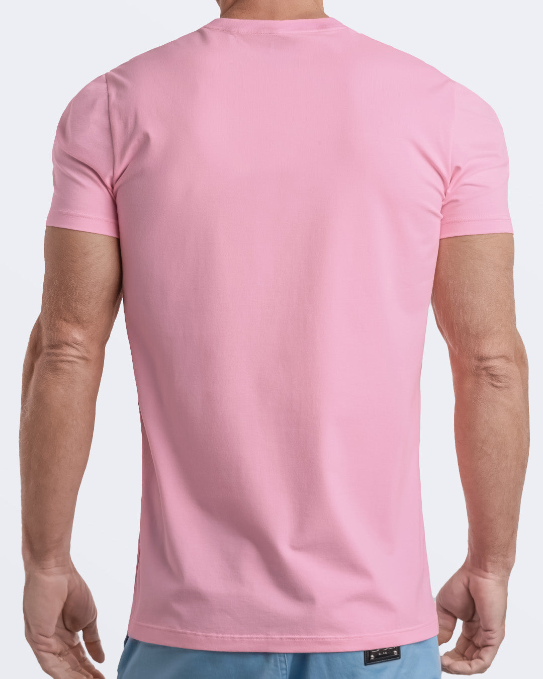 Back view of a pale light pink men's t-shirt, made from soft, durable and breathable modal cotton. Part of the DC2 Miami men's streetwear and beachwear collection, ideal for casual summer outfits.