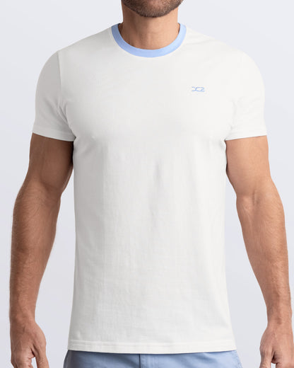 Frontal view of a male model wearing a solid white Pima cotton t-shirt with a light blue collar, crafted for stylish casual wear and beachwear by DC2 Miami. Premium quality men's streetwear t-shirt, perfect fit for summer fashion.