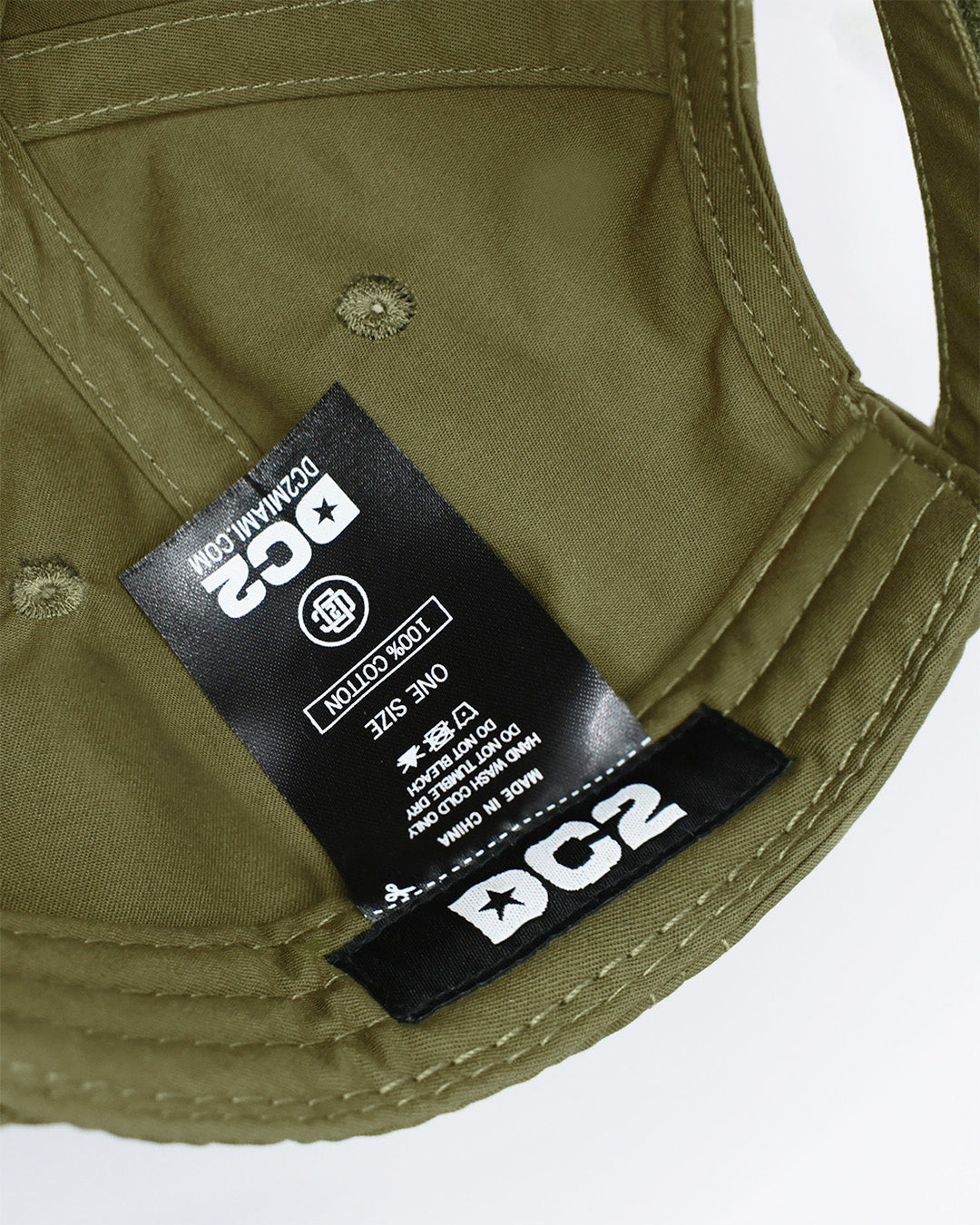 Close-up of a MAGNUM GREEN Baseball Cap from DC2 Clothing from Miami.