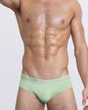 DC2 MISS YOU MUCH — model wearing MISS YOU MUCH Modal Briefs, featuring soft mint green color and contrast waistband with white piping.