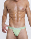DC2 MISS YOU MUCH Modal Thong — front view in mint green with soft cotton pouch and bold statement waistband text.