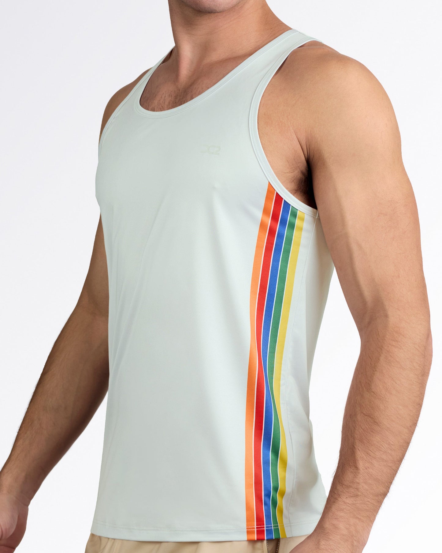 DC2 Mixtape Stripes Gym Tank Top — model wearing light sage men’s tank with vertical multicolor stripe panel in orange, red, blue, green, and yellow along the side.
