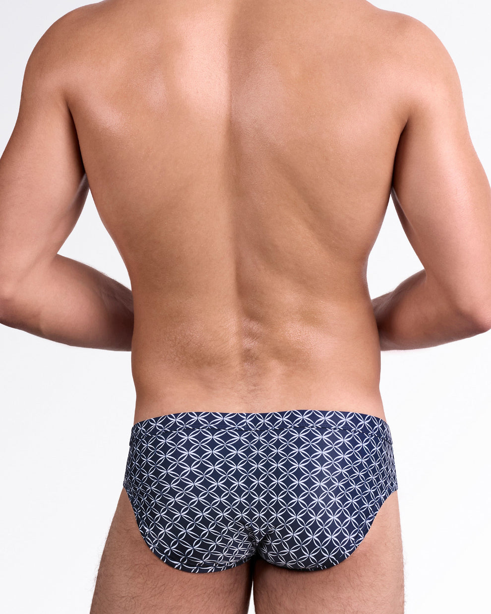 DC2 Mono Waves (Blue) Swim Brief — back view showcasing allover circular wave motif in white on deep blue background with contoured rear cut.