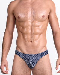 DC2 Mono Waves (Blue) — model wearing Mono Waves (Blue) Swim Mini Brief featuring a deep navy base with geometric white wave pattern.