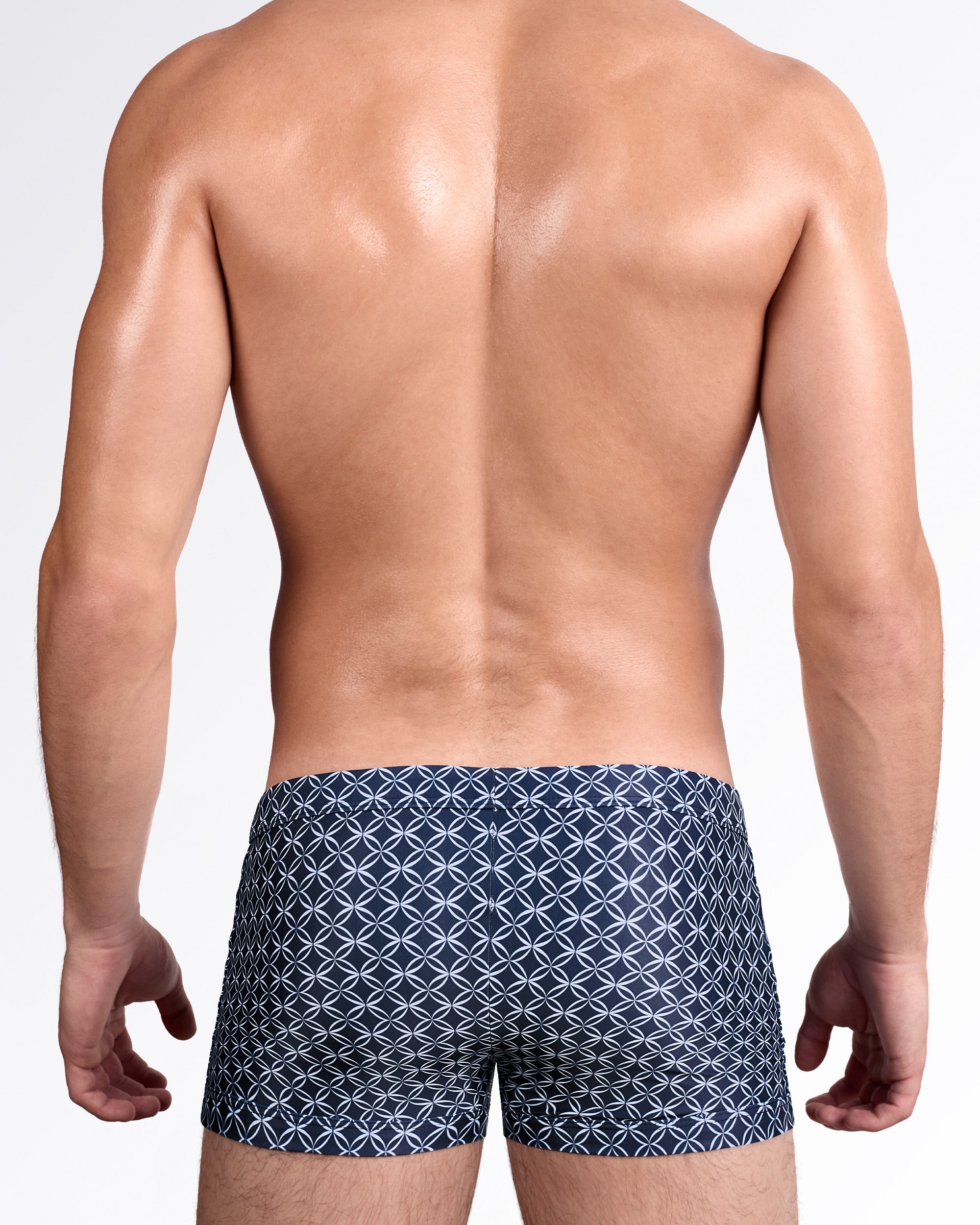 DC2 Mono Waves (Blue) Swim Trunk — back view showing full trunk coverage with continuous allover geometric print and clean seam construction.