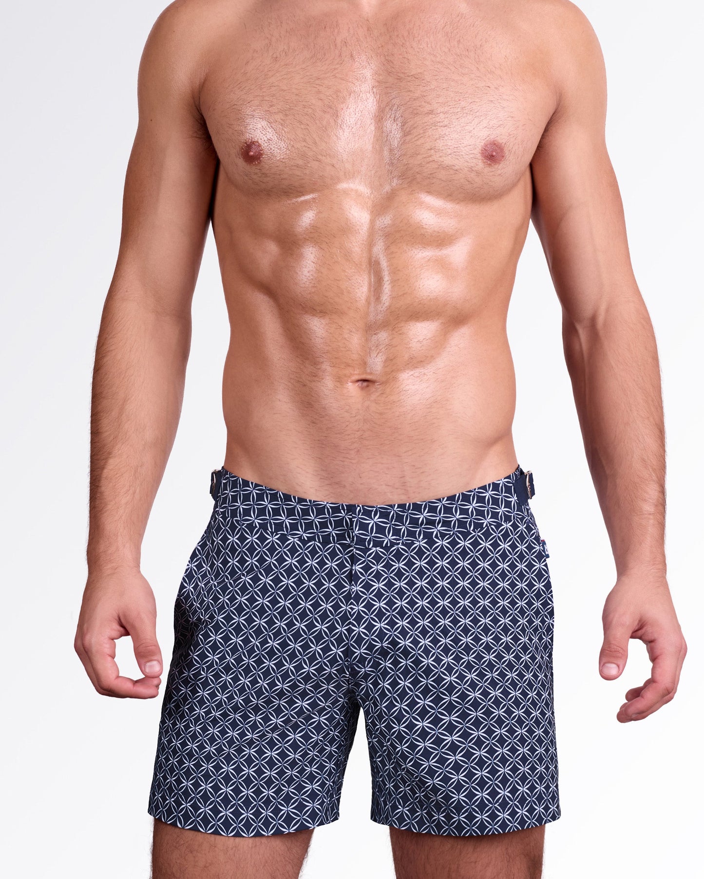 DC2 Miami Mono Waves (Blue) Tailored Shorts — model wearing men’s tailored swim shorts in navy blue with geometric wave pattern, featuring structured waistband with side adjusters and a clean tailored fit.