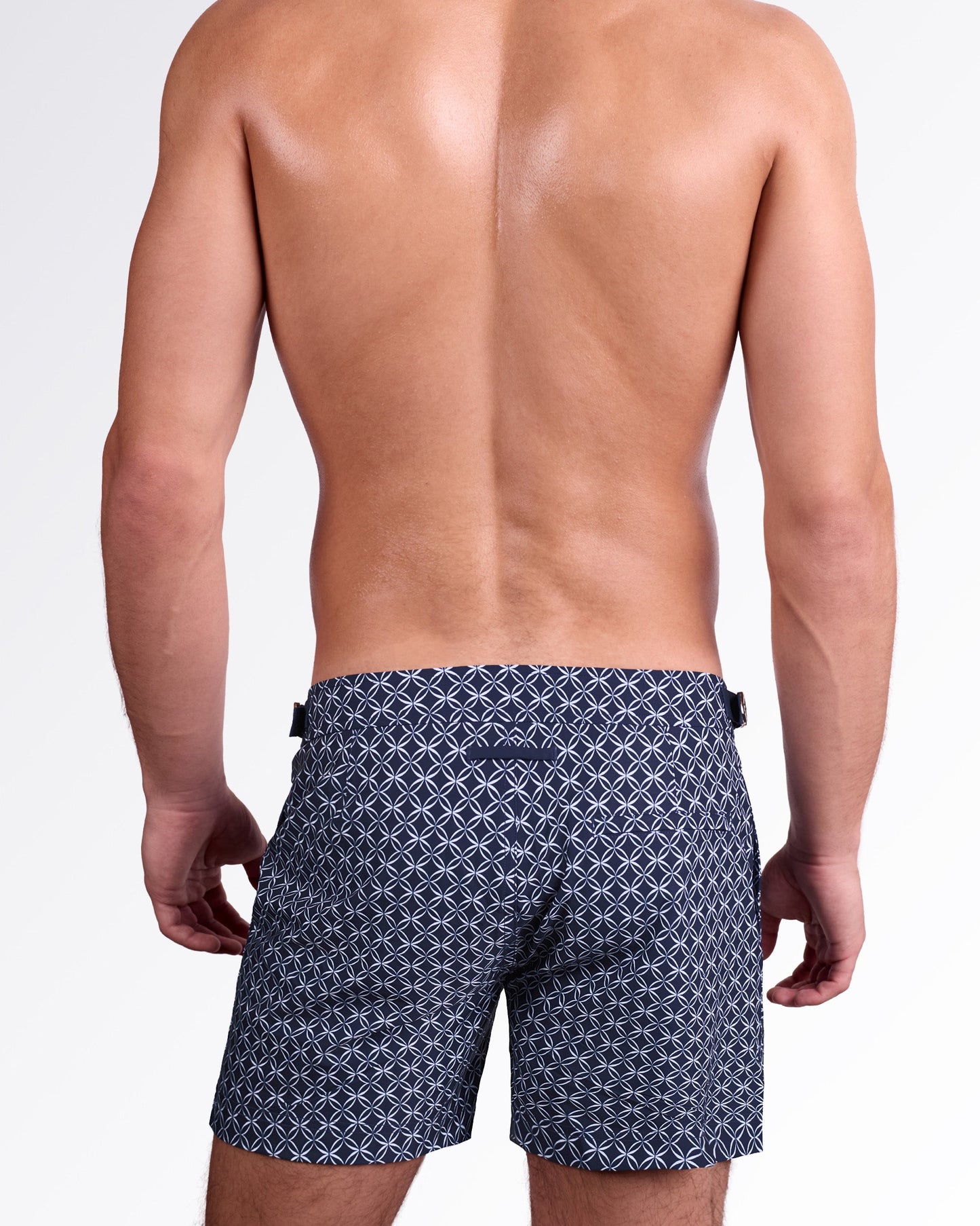 DC2 Miami Mono Waves (Blue) Tailored Shorts — back view highlighting tailored silhouette, rear welt pocket, and all-over tonal wave pattern on smooth premium swim fabric.