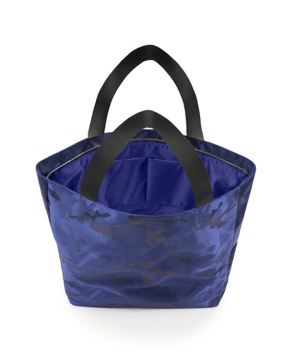 Back view of the NAVY BLUE CAMO Poolside Tote Bag by DC2 Miami, highlighting the subtle blue camouflage pattern across the entire exterior. The bag features wide, sturdy black handles and a spacious interior, perfect for carrying essentials for beach trips or everyday use.