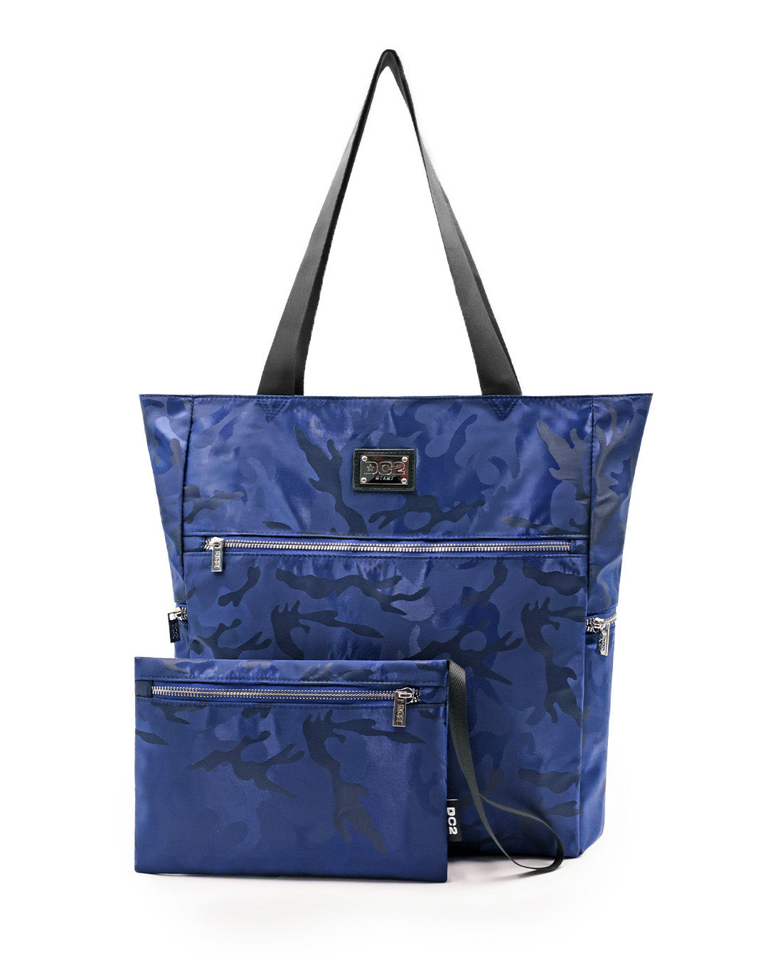 Front view of the NAVY BLUE CAMO Poolside Tote Bag by DC2 Miami, featuring a sleek blue camouflage pattern. The tote is spacious with durable black handles and multiple zippered compartments, including a detachable pouch with a matching design. Made from high-quality, water-resistant material, this versatile tote bag is perfect for beach outings or casual everyday use.