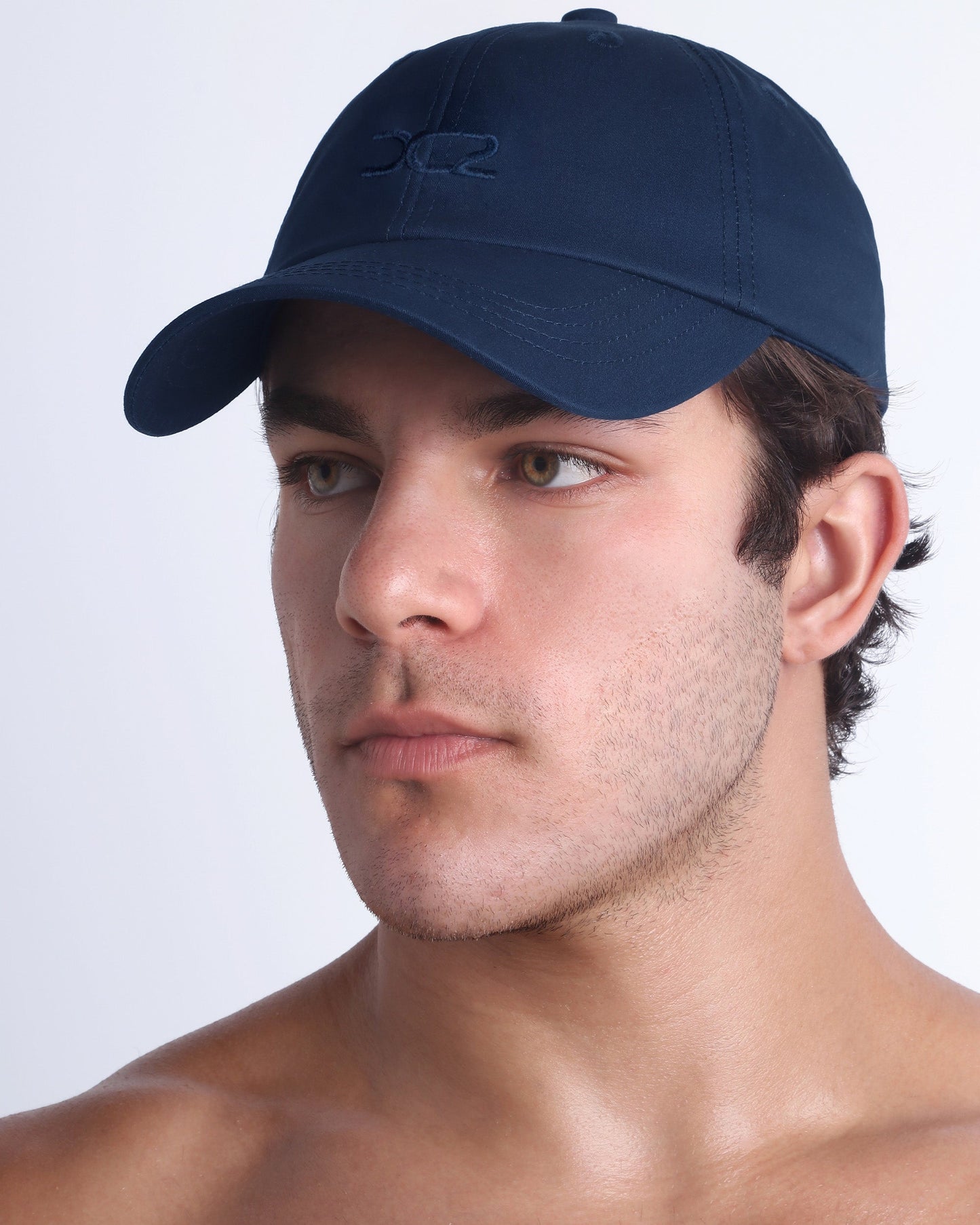 DC2 navy resort cap on model, curved brim baseball cap with a clean, modern fit.