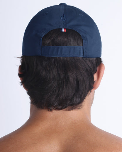 Back view of DC2 navy resort cap, adjustable strap closure with a sleek, understated finish.