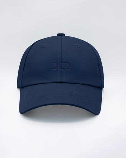 DC2 Resort Cap in Navy Blue — front view showcasing a curved brim, structured crown, and tonal embroidered DC2 logo.