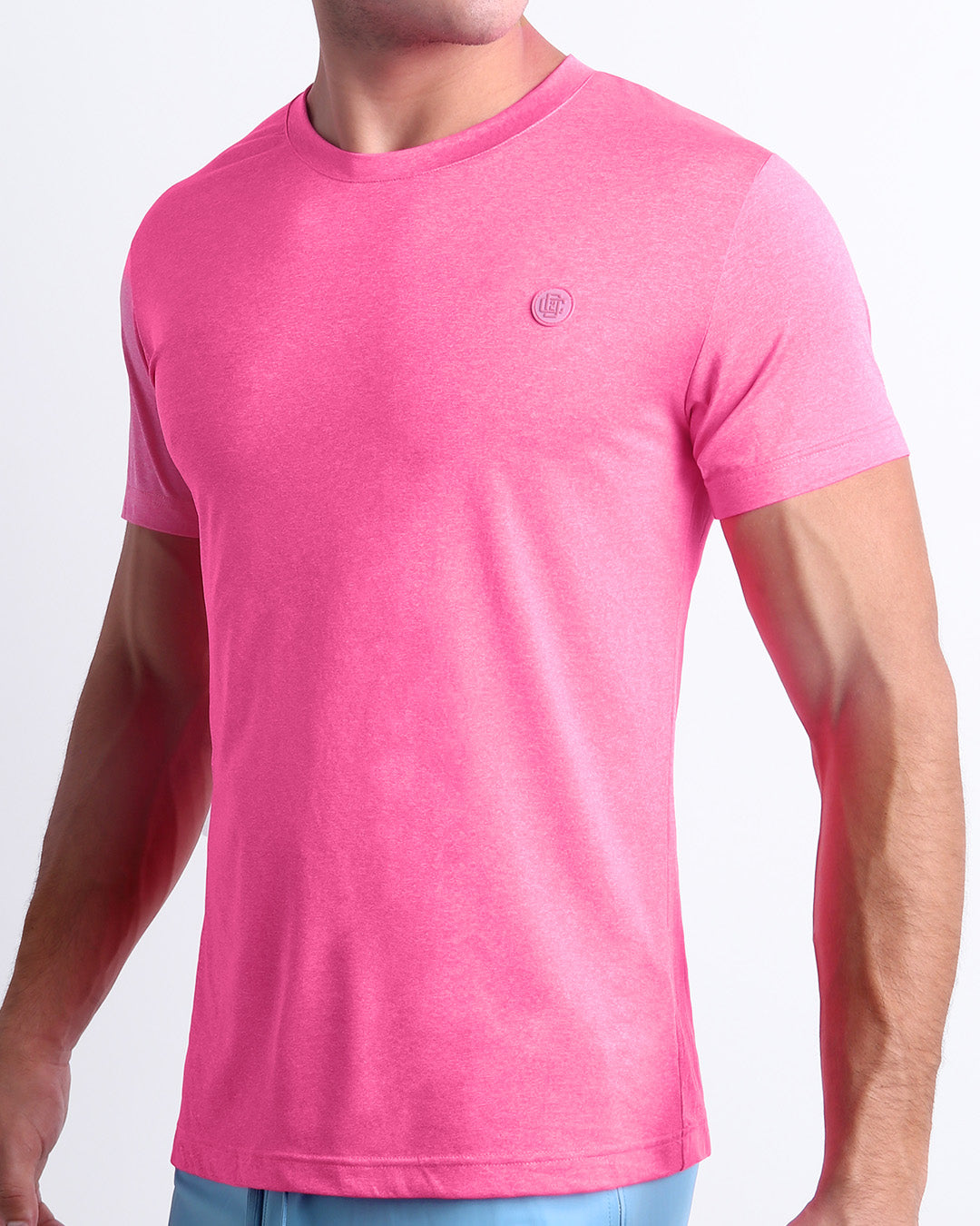 Side view of men’s performance exercise top in a bright pink color made by DC2 the official brand of mens sportswear.