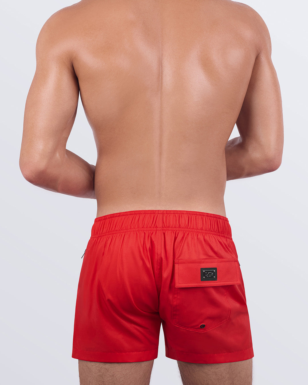 A back view of the PRIME RED - Flex Shorts, showcasing the elasticated back waistband, secure flap pocket, and water-resistant design.