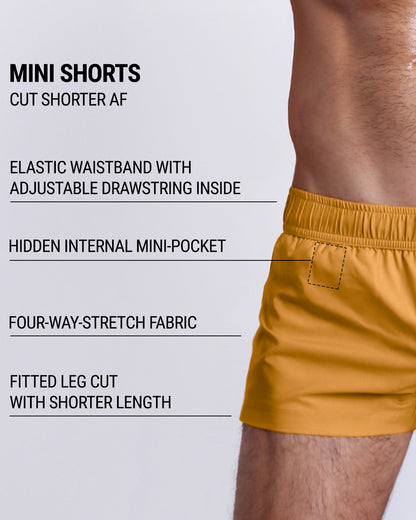 Infographic explaining the many features of the RETRO MUSTARD Mini Shorts. These MINI SHORTS have elastic waistband with adjustable drawstring inside, hidden internal mini-pocket, 4-way stretch fabric, and are quad friendly with fitted leg cut with shorter leg length.