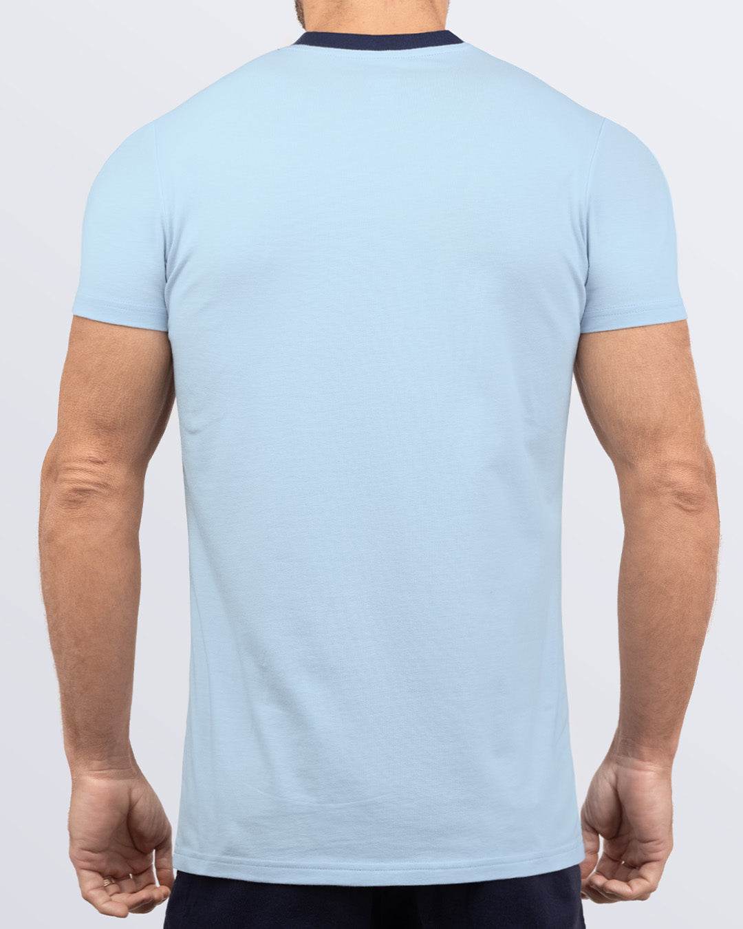 Back view of a light blue men's t-shirt with a striking dark navy collar, made from soft, durable and breathable Pima cotton. Part of the DC2 Miami men's streetwear and beachwear collection, ideal for casual summer outfits.