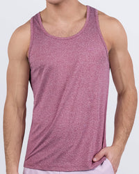 Male model wearing DC2 RIPPED CRIMSON gym tank top in deep heather red, designed for men’s workouts and fitness training. Breathable, moisture-wicking fabric ideal for gym and beach.