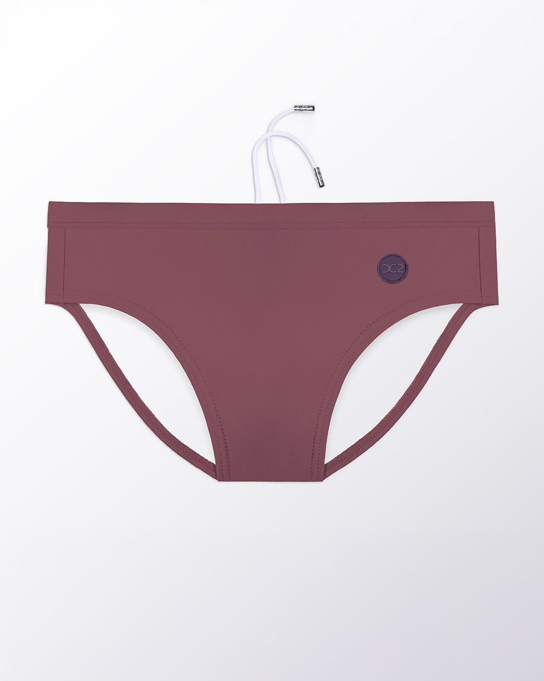 Flat lay of the DC2 Sandbar Red Swim Brief, highlighting the smooth fabric, contoured front, and minimal coverage fit.