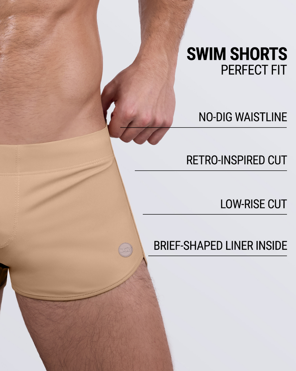 DC2 SKINNY DIP (MEDIUM) swim shorts in beige tan shown from side view with feature overlay highlighting no-dig waistband, low-rise cut, and inner brief-shaped liner.