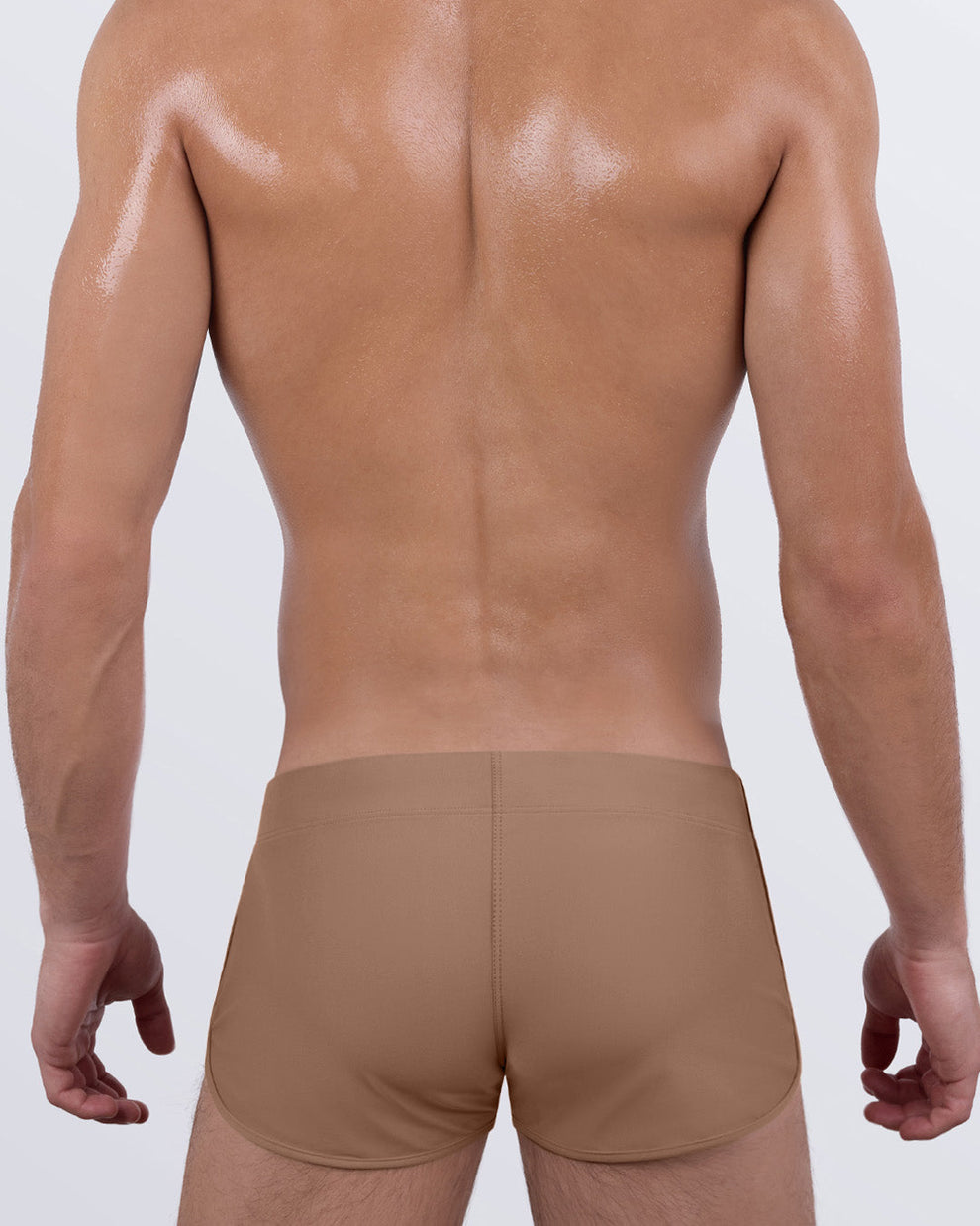 Back view of Skinny Dip TAN men's swim shorts by DC2 Miami, showcasing smooth contour fit and soft stretch fabric.
