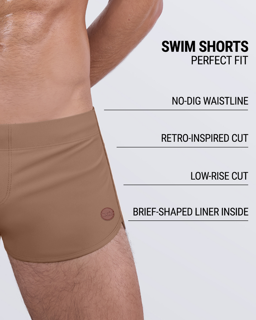 Side view of DC2 Miami Skinny Dip TAN men's swim shorts with text overlay highlighting features: no-dig waistline, retro cut, low-rise fit, and inner liner.
