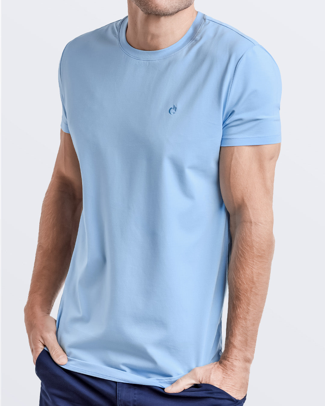 Side view of a men's premium light blue modal cotton t-shirt and embroidered DC2 logo. Perfect for a modern casual look, this streetwear tee is part of the DC2 Miami men's beachwear collection, designed for comfort and style.