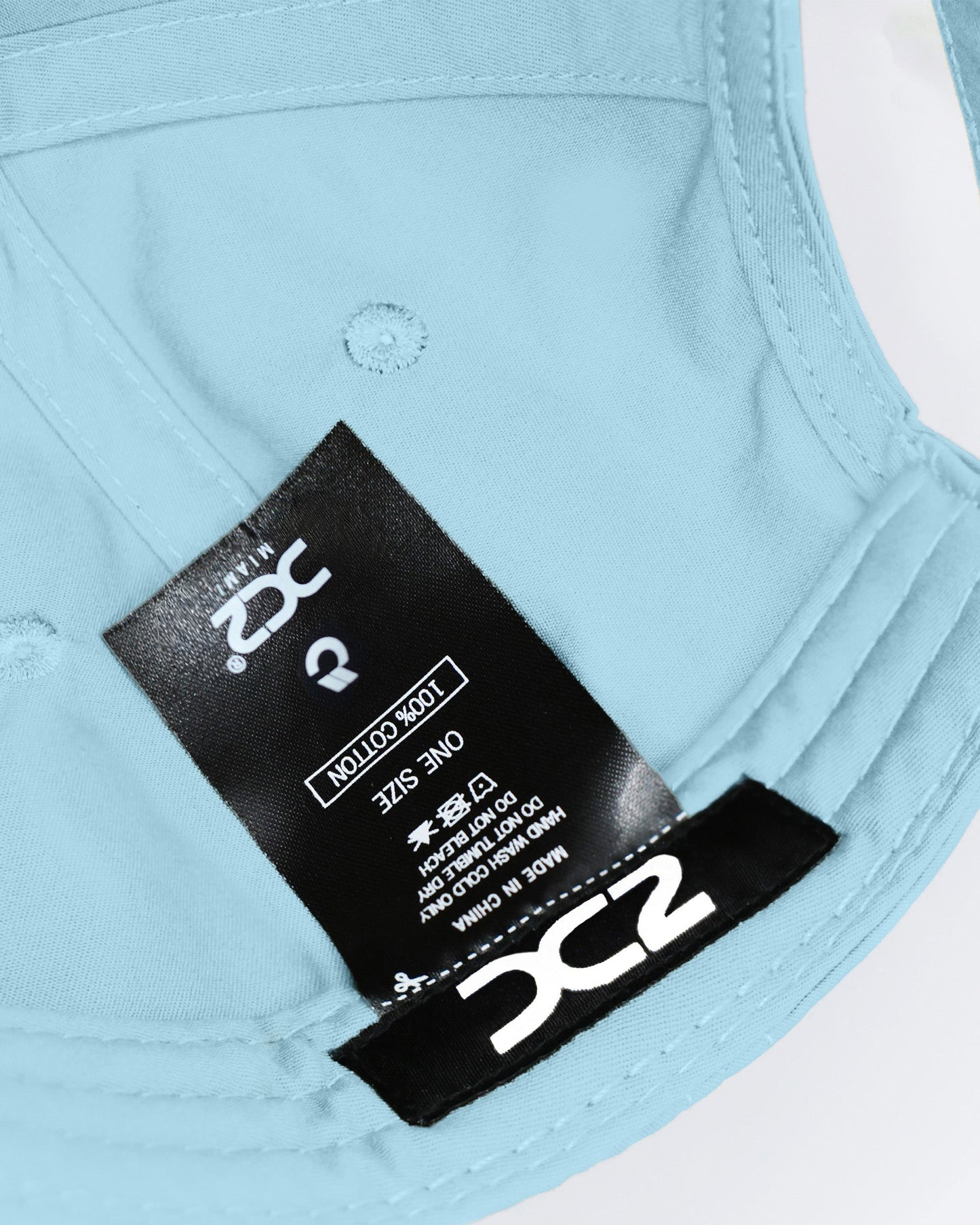 Interior view of the DC2 Sky Blue Resort Cap — showing soft cotton lining, branded label, and adjustable construction.