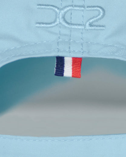 Back detail of the DC2 Resort Cap in Sky Blue — featuring tonal stitching and a woven tricolor accent tab.
