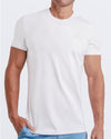 Frontal view of a male model wearing a solid white color modal cotton t-shirt, crafted for stylish casual wear and beachwear by DC2 Miami. Premium quality men's streetwear t-shirt, perfect fit for summer fashion.