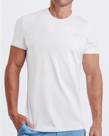 Frontal view of a male model wearing a solid white color modal cotton t-shirt, crafted for stylish casual wear and beachwear by DC2 Miami. Premium quality men's streetwear t-shirt, perfect fit for summer fashion.