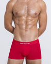 DC2 SOME LIKE IT HOT Boxer Brief — model wearing red men’s modal boxer briefs with logo waistband.