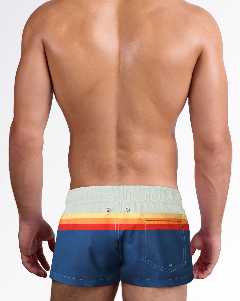 Back view of Sunset Stripes Mini Shorts showcasing the retro stripe design wrapping around the waist, rear pocket, and tailored swim silhouette.