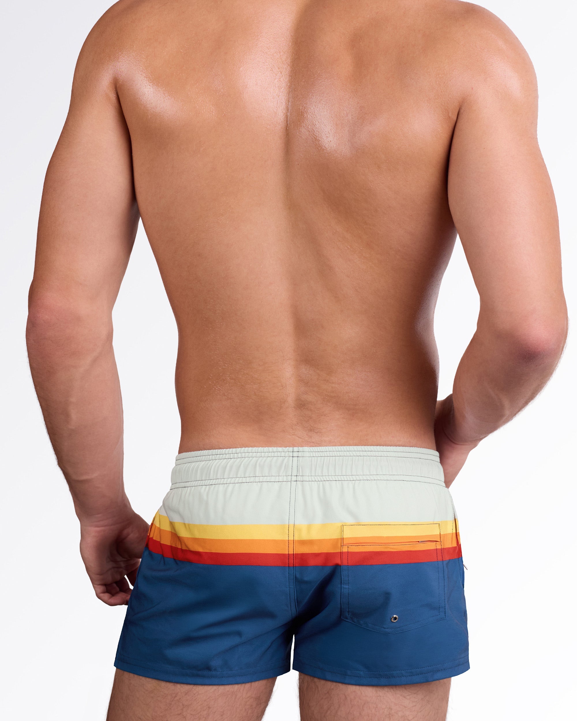 DC2 Sunset Stripes Poolside Shorts — back view highlighting the horizontal sunset stripe pattern and rear pocket detail on the blue swim shorts.