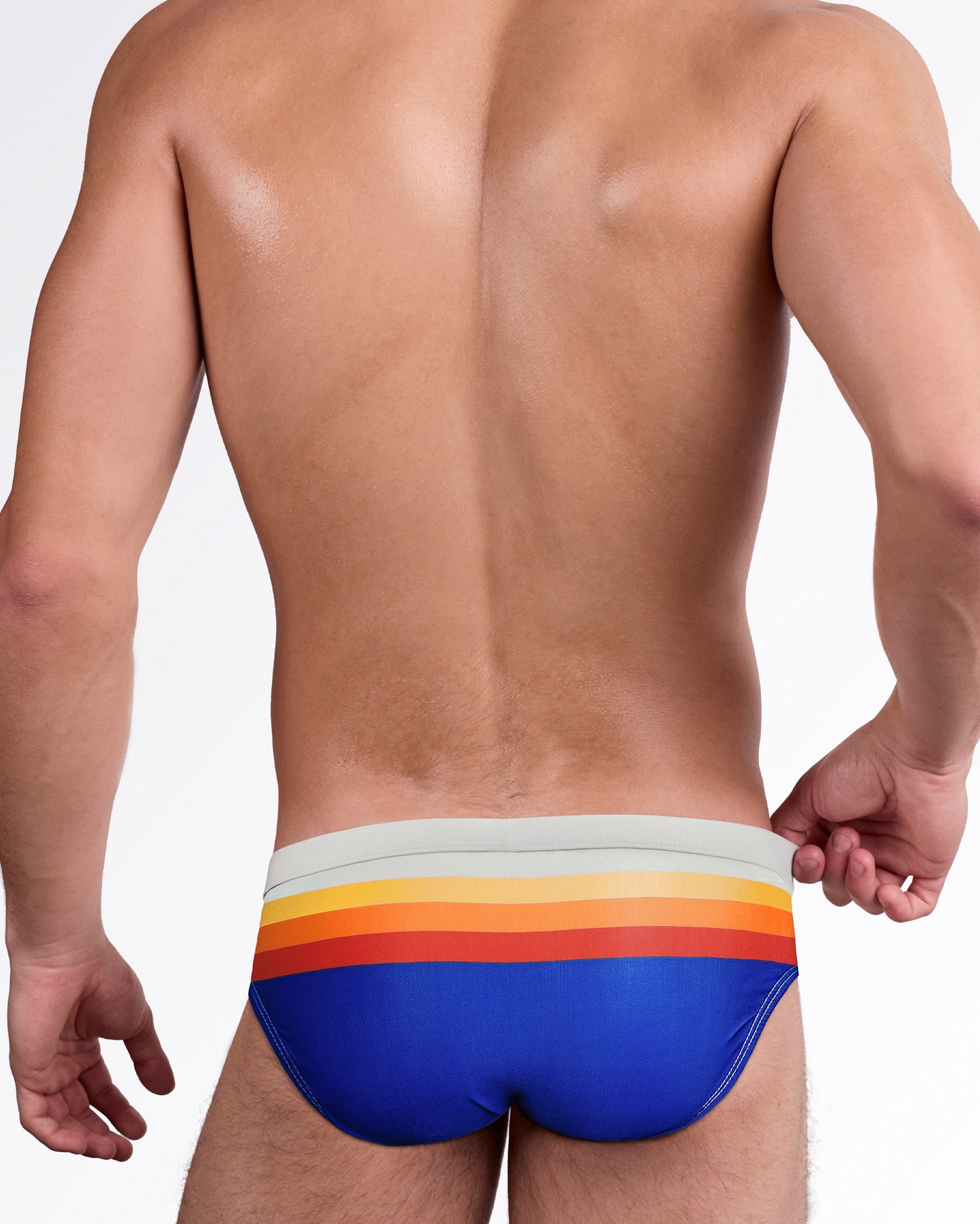 Sunset Stripes Swim Brief — showcasing premium stretch swim fabric, quick-dry performance, supportive front pouch, contrast stitching, and signature DC2 logo patch.