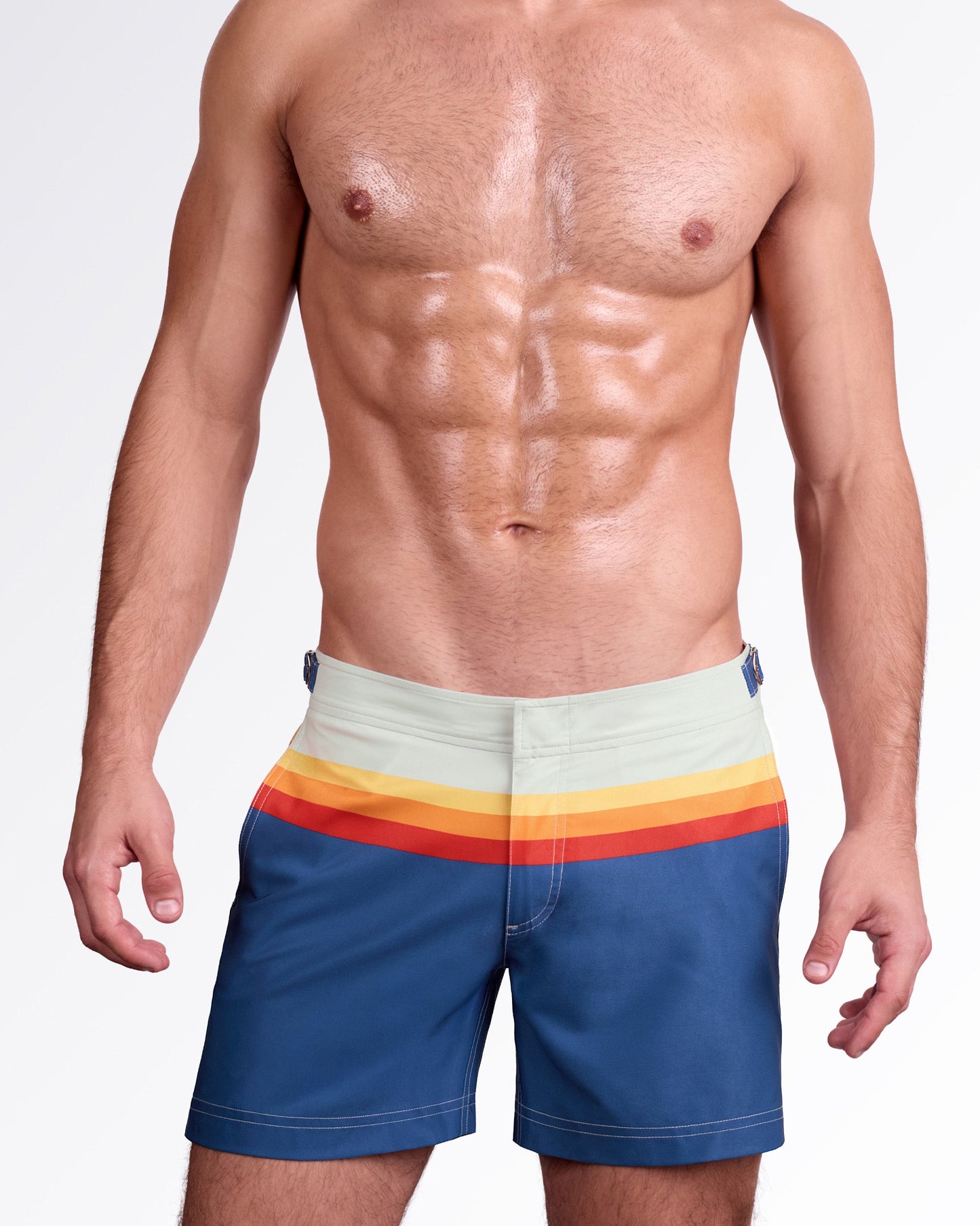 DC2 Miami Sunset Stripes Tailored Shorts — model wearing men’s tailored swim shorts in navy blue with horizontal sunset stripe panel in yellow, orange, and red, featuring structured waistband with side adjusters and a clean tailored fit.