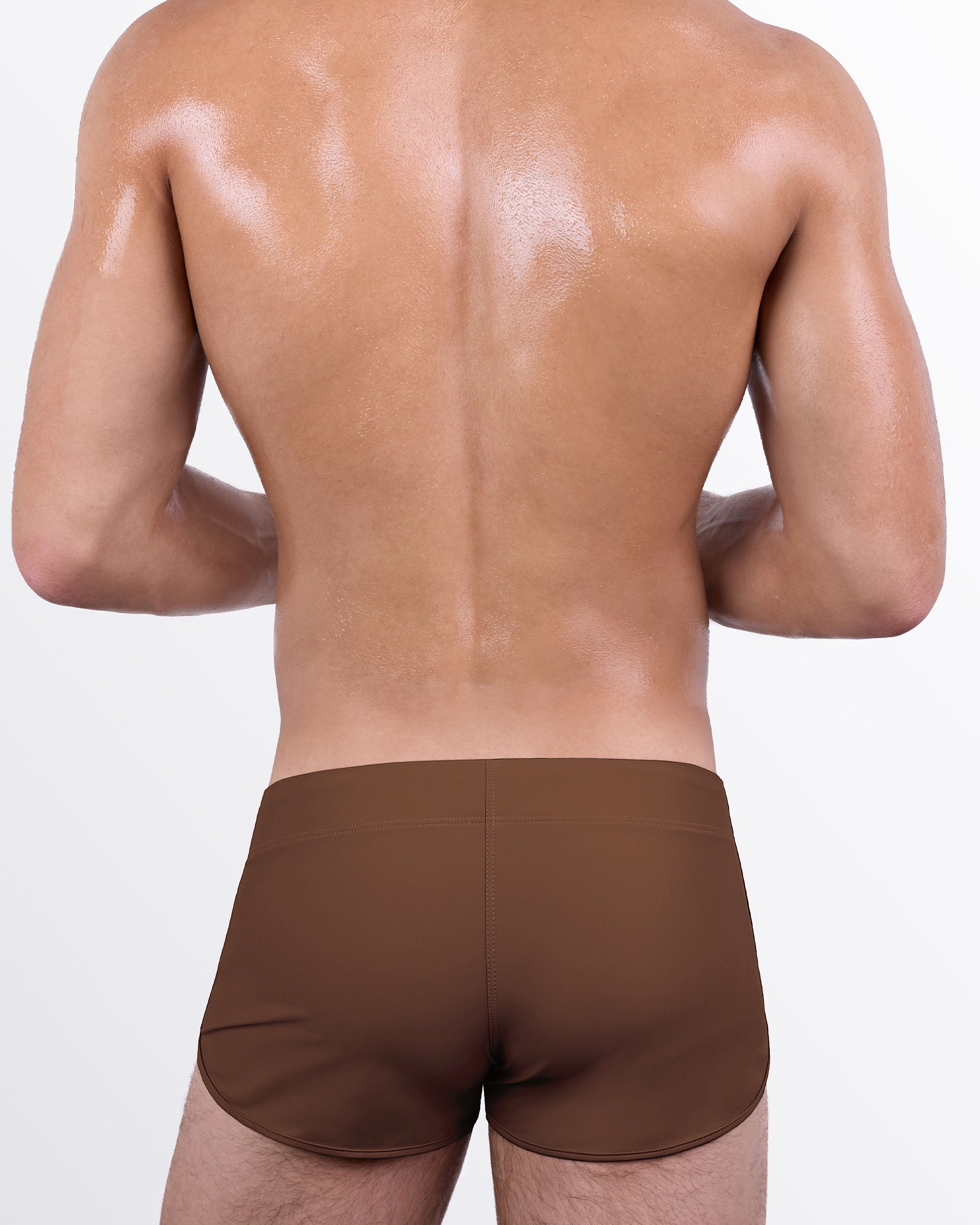 Back view of the That’s That Me Espresso Swim Short showcasing a sleek espresso brown finish, athletic fit, and streamlined men's swimming shorts.