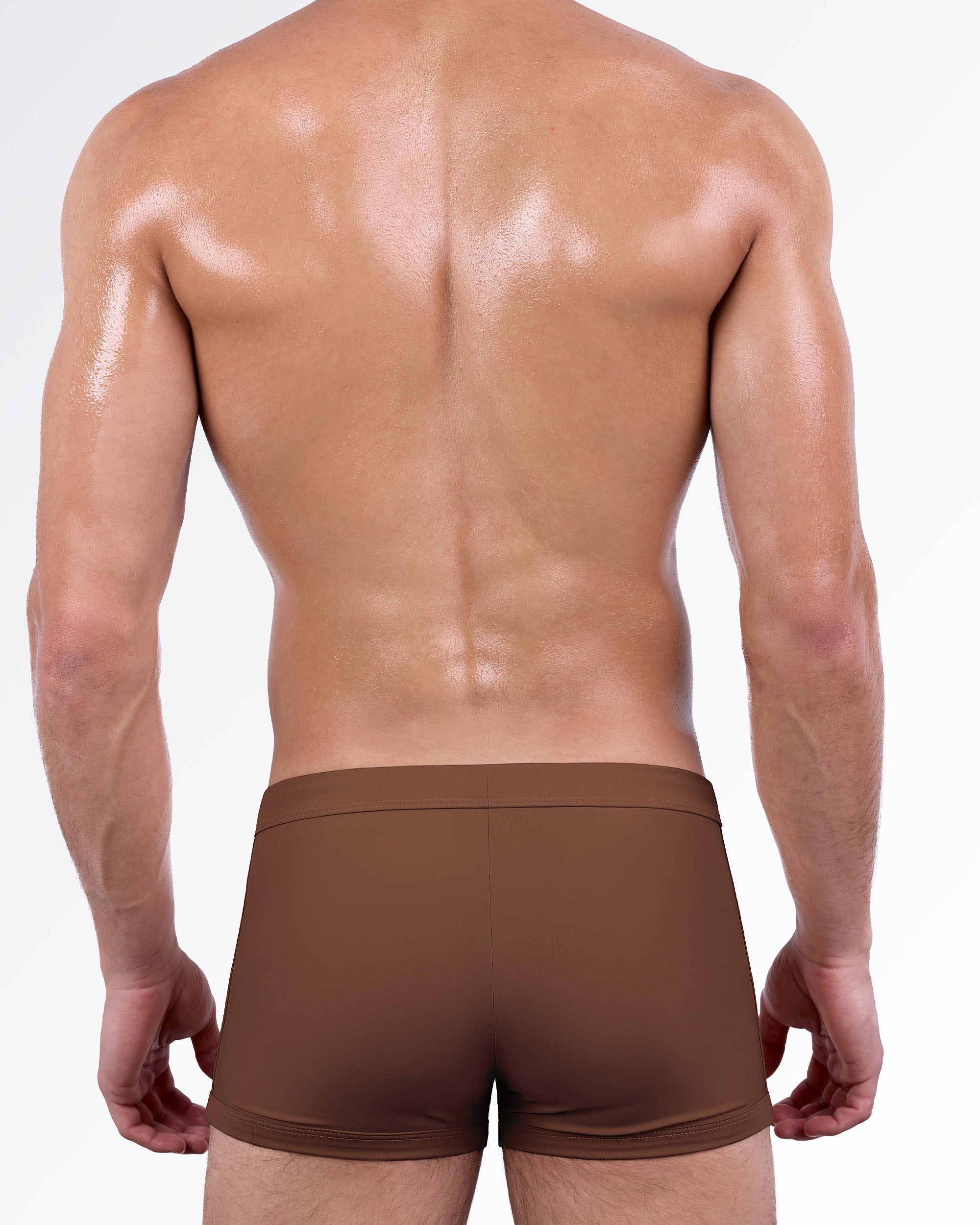Back view of the That’s That Me Espresso Swim Trunk showcasing a sleek espresso brown finish, streamlined fit, and comfortable full-coverage men's swimsuit.