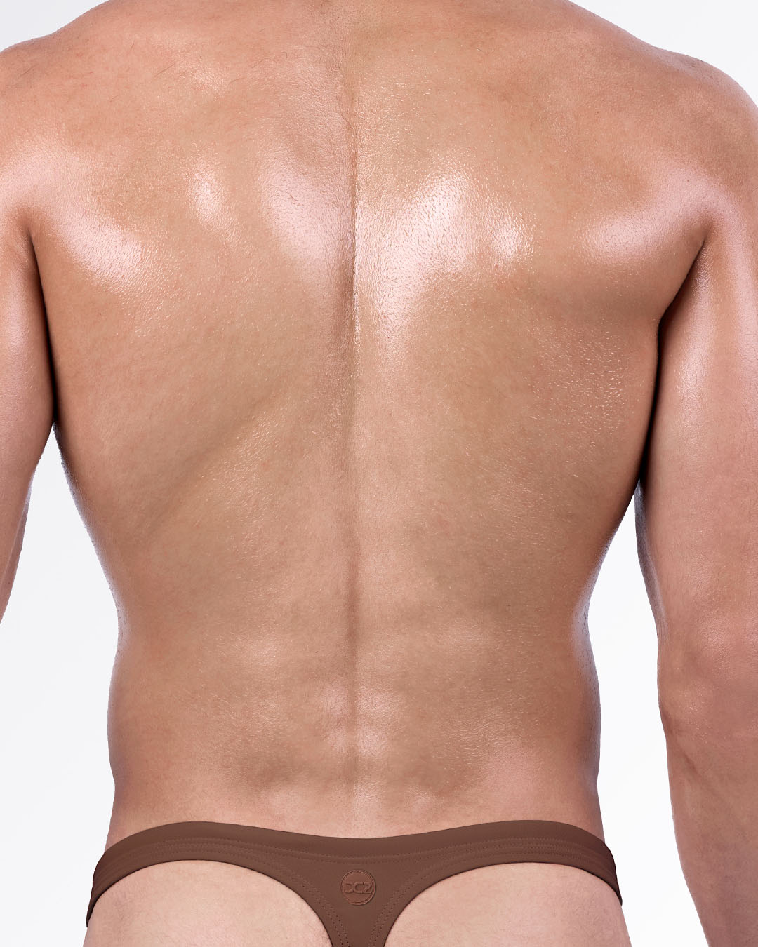 Back view of the That’s That Me Espresso Swim Thong by DC2 Miami, showing the sleek brown thong silhouette.