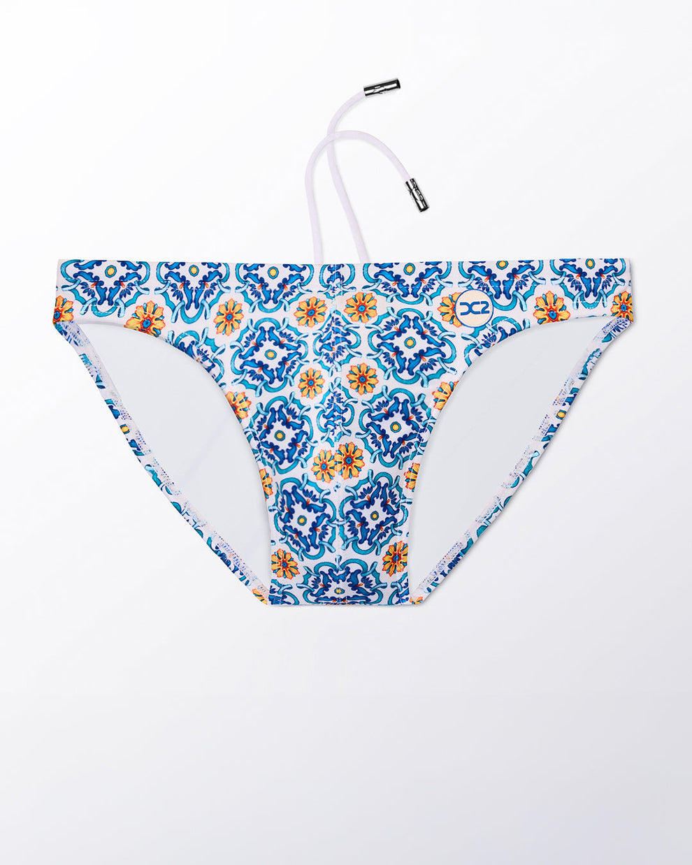 Ghost flat lay of the The Tile Is High Swim Mini Brief, highlighting the tile-inspired pattern, contoured front, and minimal coverage fit.