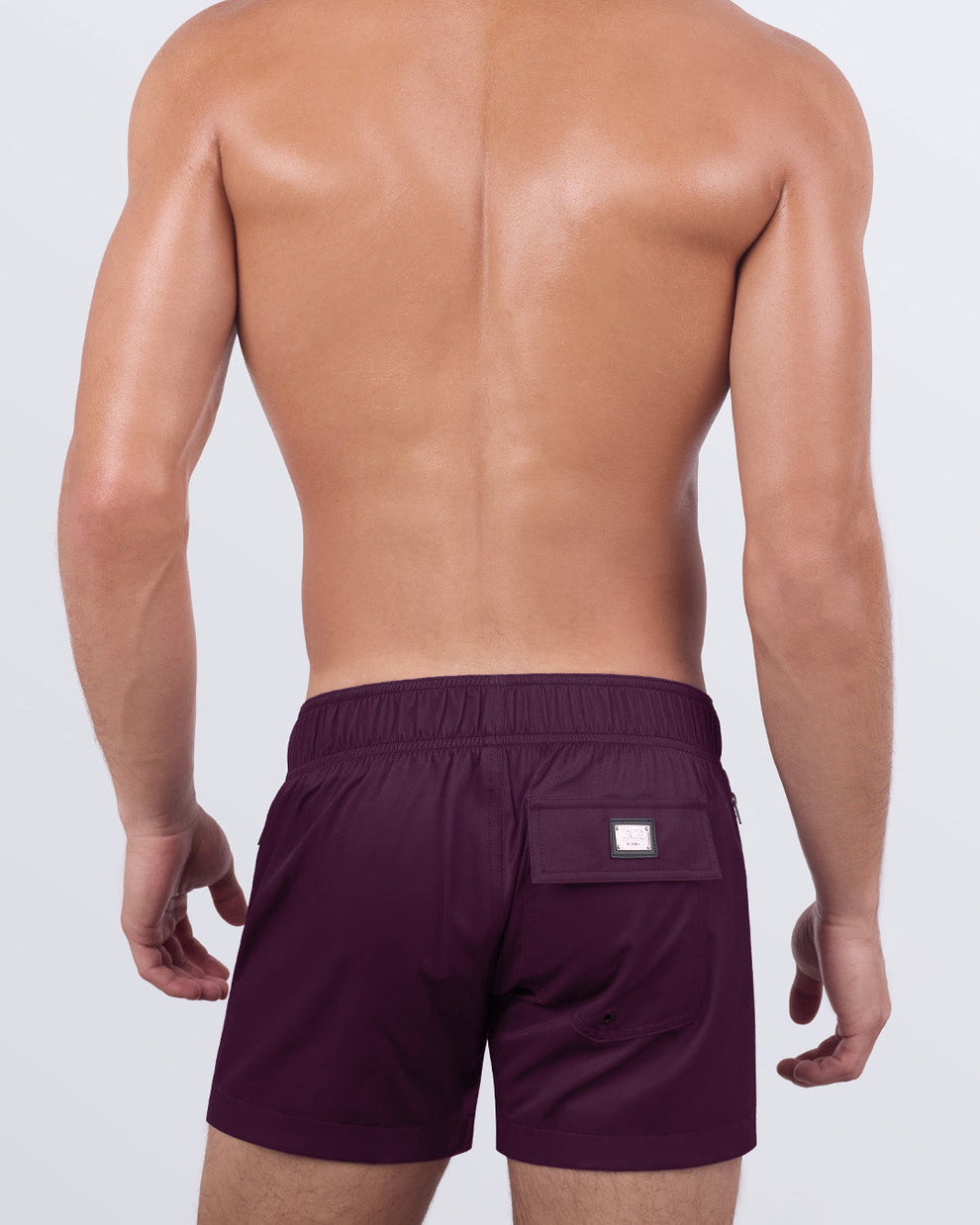 Back view of the VERY BERRY - Flex Shorts, highlighting the secure back pocket with a signature logo patch and an elasticated waistband for maximum comfort.