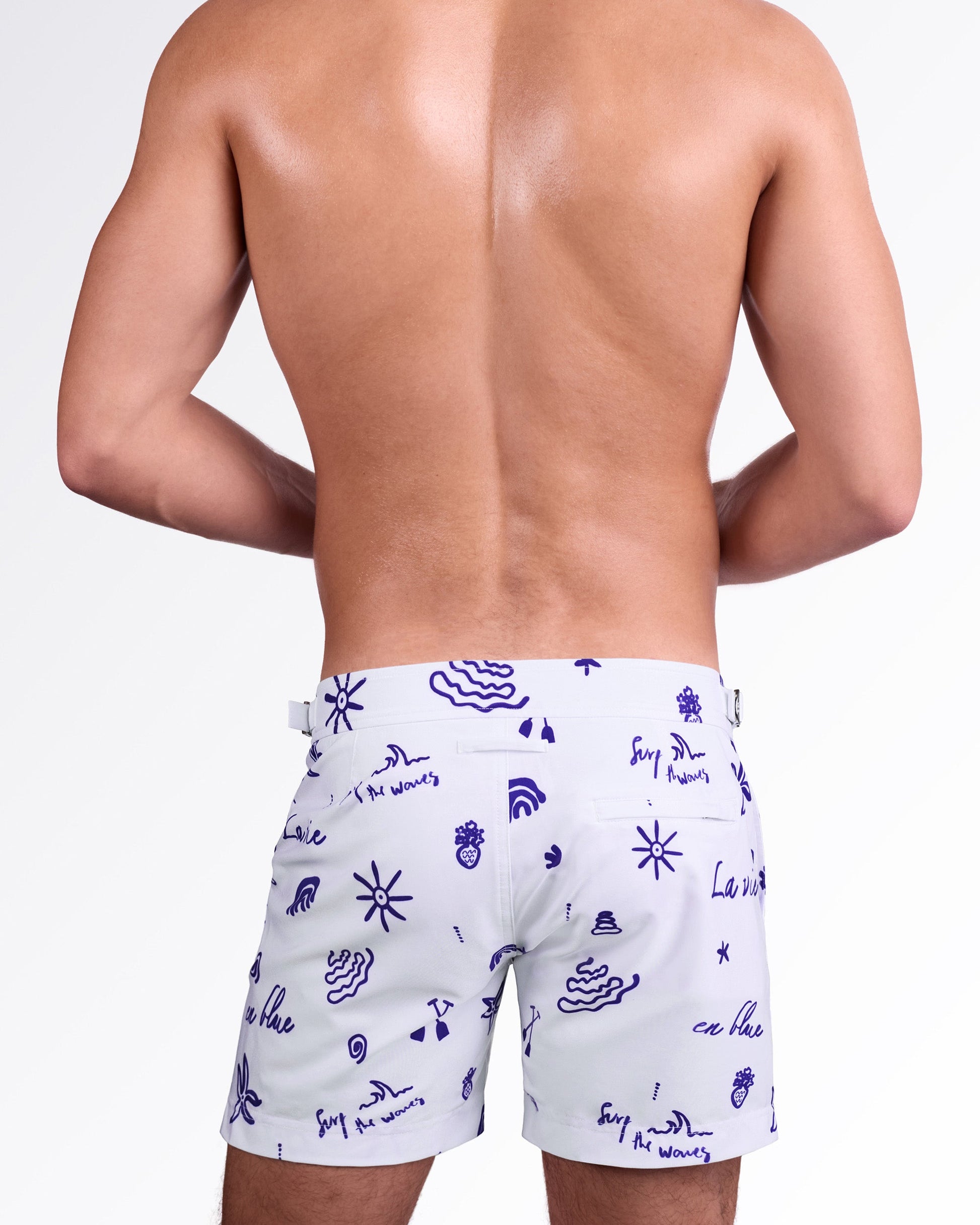 DC2 Miami Viva La Vida (Blue) Tailored Shorts — back view highlighting tailored silhouette, rear welt pocket, and all-over hand-drawn navy print on smooth premium swim fabric.
