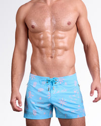DC2 Miami Viva La Vida (En Rose) Flex Shorts — model wearing men’s swim shorts in sky blue with soft pink graphic print, featuring lace-up waistband and tailored flex fit.