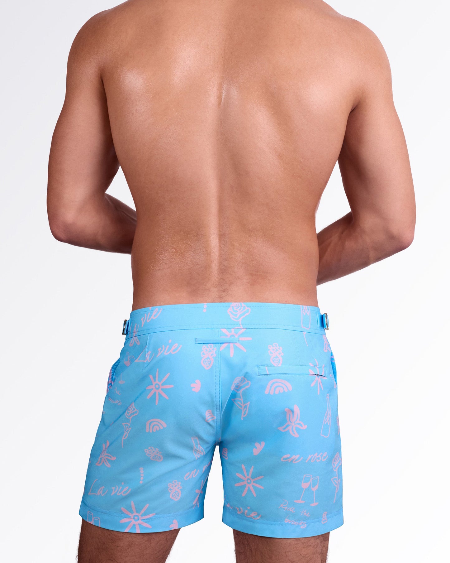 DC2 Miami Viva La Vida (En Rose) Tailored Shorts — back view highlighting tailored silhouette, rear welt pocket, and all-over pink “La vie en rose” inspired print on smooth premium swim fabric.