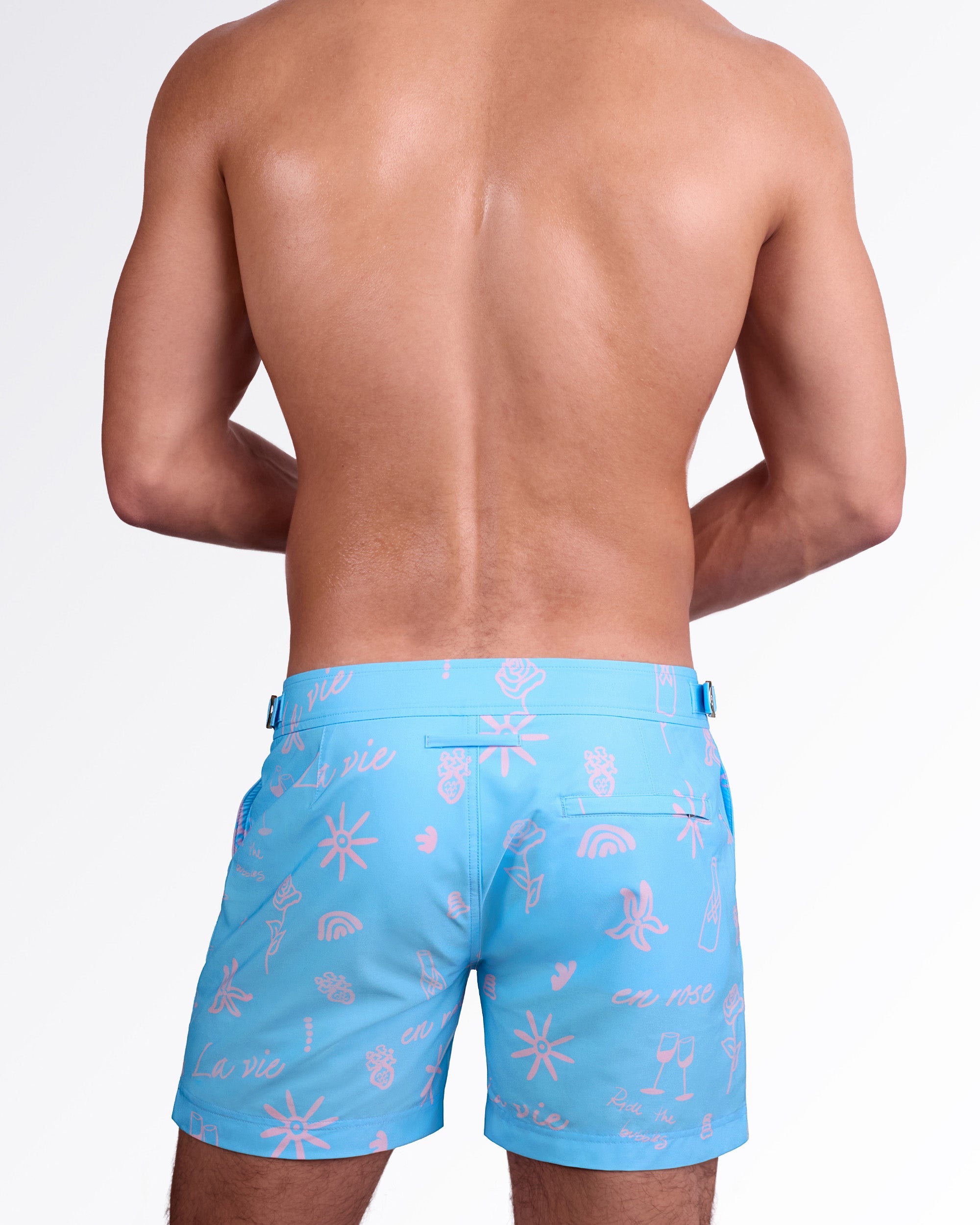 DC2 Miami Viva La Vida (En Rose) Tailored Shorts — back view highlighting tailored silhouette, rear welt pocket, and all-over pink “La vie en rose” inspired print on smooth premium swim fabric.