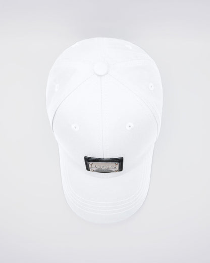 Close-up of a WHITE Baseball Cap with polished DC2 metallic silver plaque. Features ventilation eyelets on the cap to provide extra breathability, perfect for active wear.