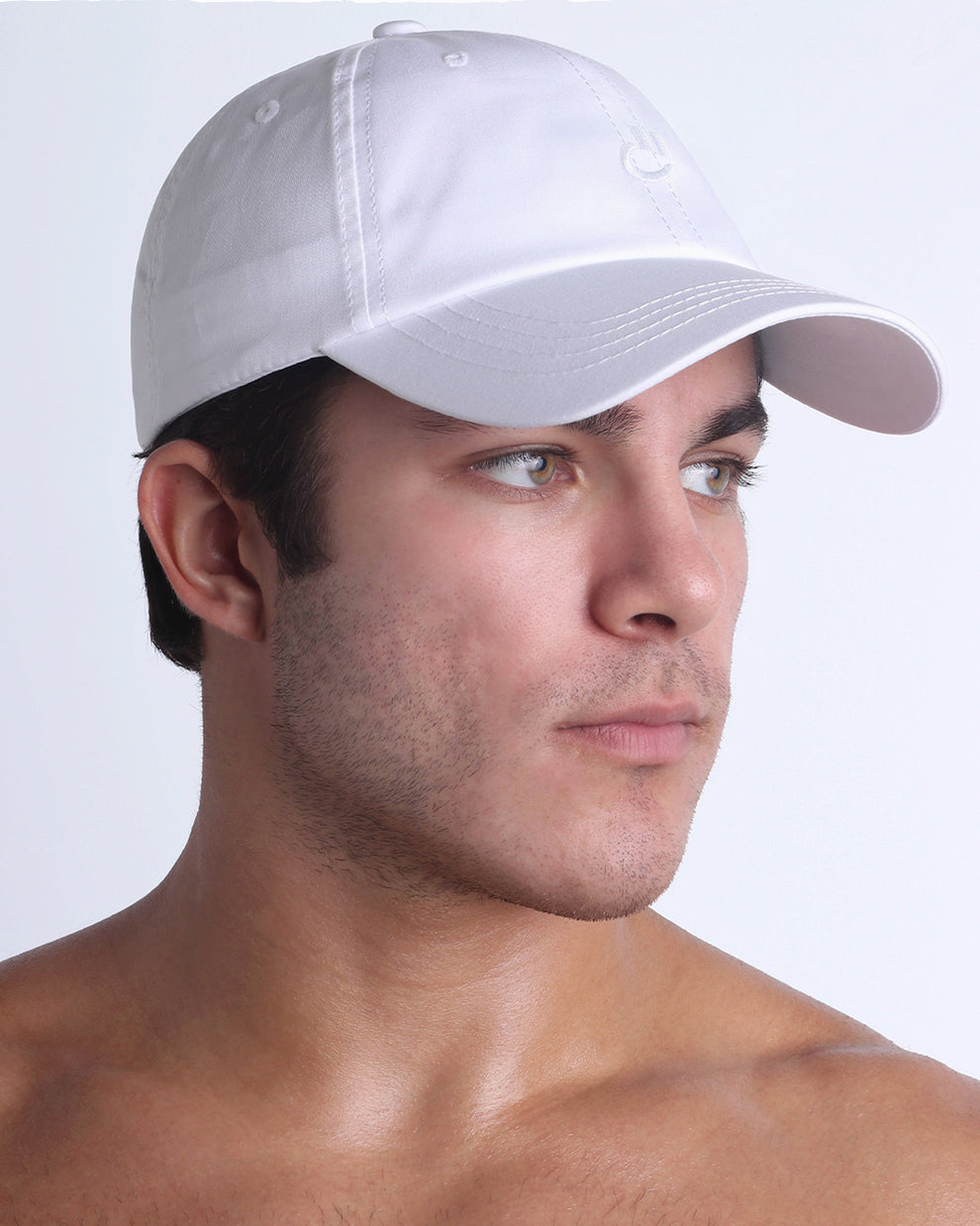DC2 white resort cap on model, curved brim baseball cap with a clean, modern fit.